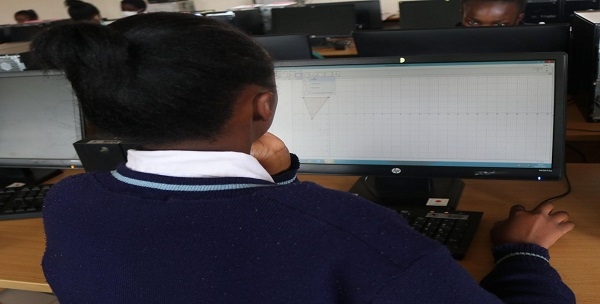 A learner in the computer Laboratory during a school visit at CEMASTEA