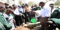 A tree planting activity at Aquinas High School by CEMASTEA during the STEM Outreach programme